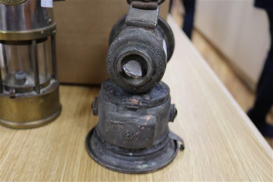 Two miners lamps and a bicycle lamp